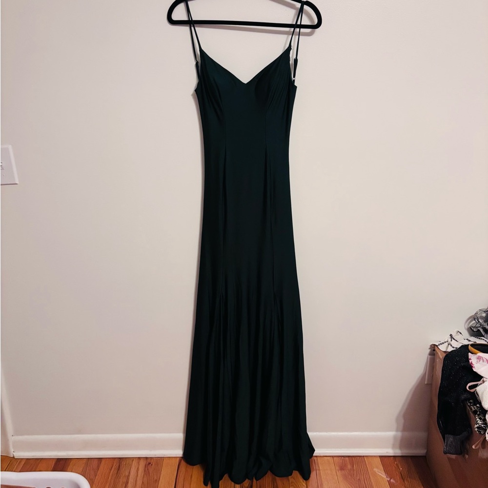 B Smart emerald green maxi dress with slit and open back. Straps are adjustable